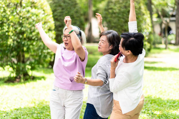 istock Three elderly Asian women partying in the park 1149568382