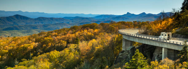 Linn Cove Viaduct panorama on the Blue Ridge parkway in autumn Cars travel on the Linn Cove Viaduct highway road on the Grandfather Mountain along the Blue Ridge Parkway in autumn North Carolina USA great smoky mountains photos stock pictures, royalty-free photos & images