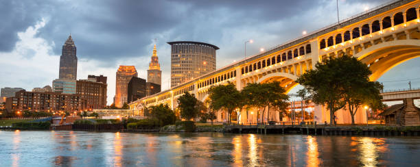 Downtown Cleveland city skyline in Ohio USA Cityscape skyline view of downtown Cleveland Ohio USA from the marina across the Cuyahoga river cleveland ohio stock pictures, royalty-free photos & images