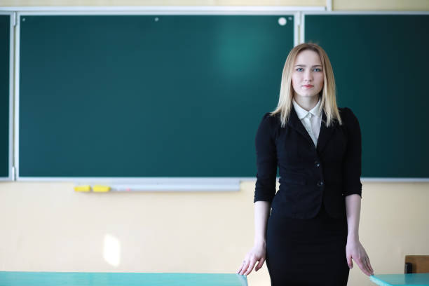 istock Young girl teacher in primary school 1149571165
