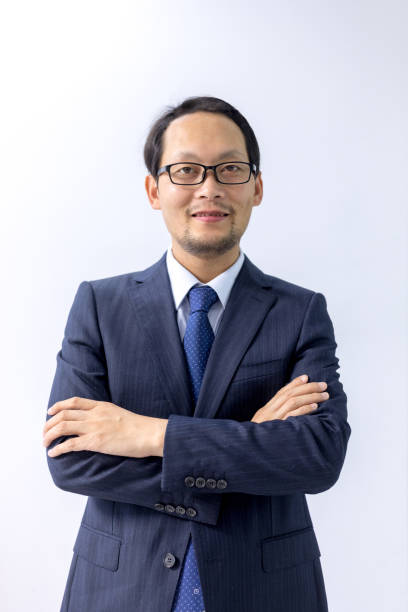 istock Chinese man, suit standing in front of white background 1149572900