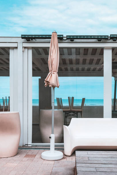 istock Terrace with sea view, closed parasol and small sofa 1149574654