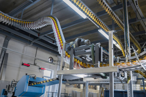 istock Conveyor belt with newspapers in printing press 1149575600