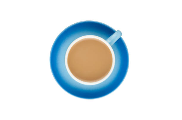 istock Single blue ceramic cup with handle full of hot fresh coffee with milk on circle saucer isolated on white background. Top view. Clipping path 1149575656