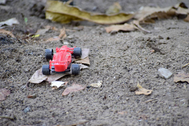 istock Red toy car on the ground 1149576111