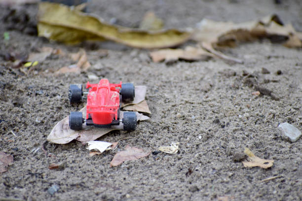 istock Red toy car on the ground 1149576114