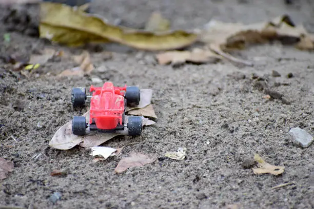 Photo of Red toy car on the ground