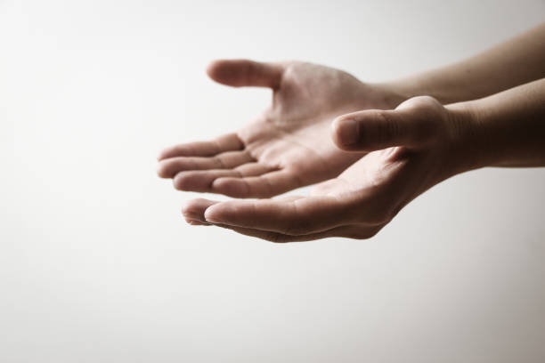 istock Silhouette rosary against cross in hand. 1149576169