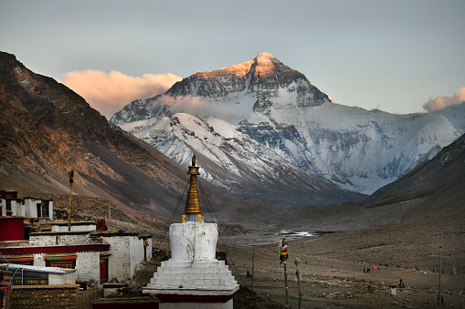 First light of dawn catches the summit of Everest North face.\nRongbuk monastery lies near the base of the north side of Mount Everest at 4,980 metres (16,340 ft) above sea level, at the end of the Dzakar Chu valley.[3][4] Rongbuk is claimed to be the highest-elevation monastery in the world