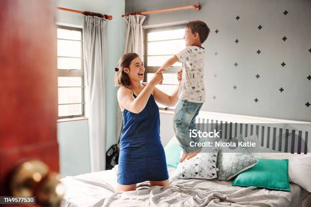 We Have The Best Of Times Together Stock Photo - Download Image Now - Bed - Furniture, Jumping, Child