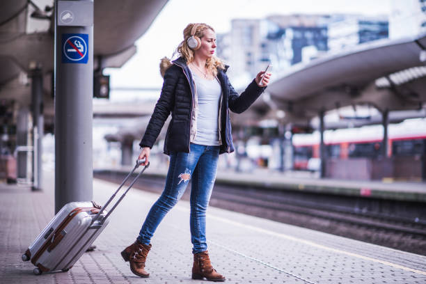 istock Beautiful blondie student walking to train. 1149577556