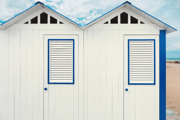 Beach cabins, blue sky and clouds on background