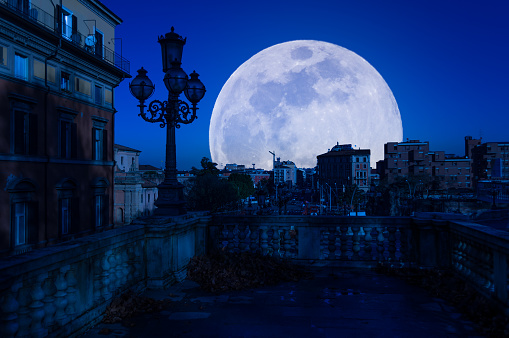 view of bologna at night with super moon
