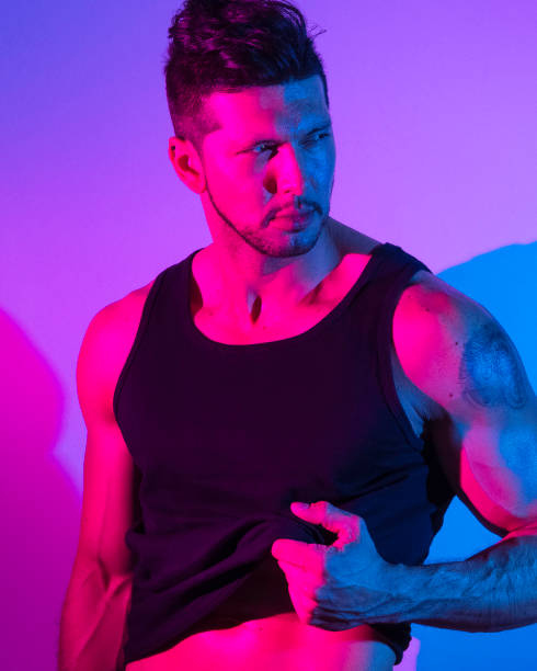istock Handsome latino man in front of colorful wall 1149584048