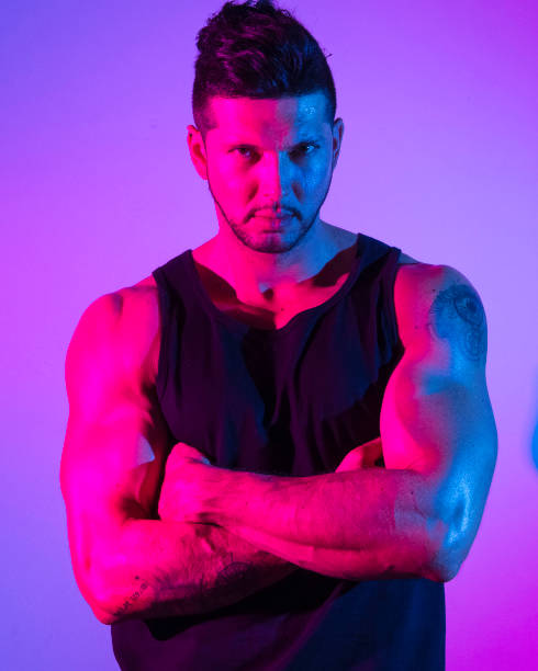 istock Handsome latino man in front of colorful wall 1149584050
