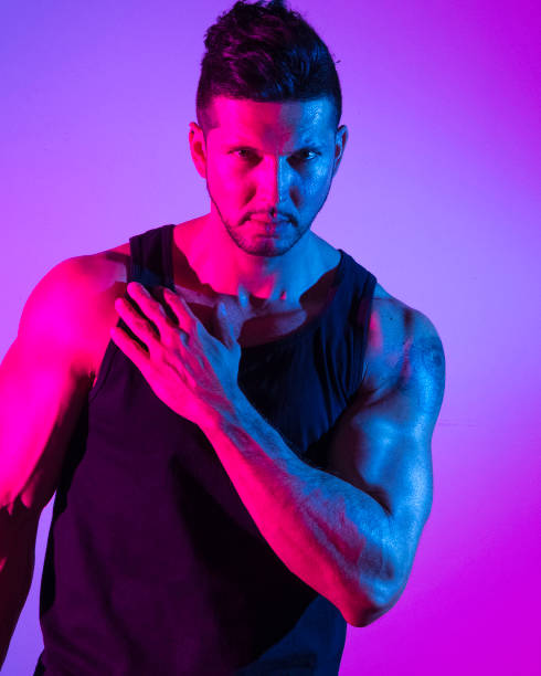 istock Handsome latino man in front of colorful wall 1149584082