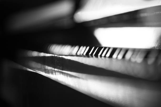 Abstract dark music background with piano keyboard.