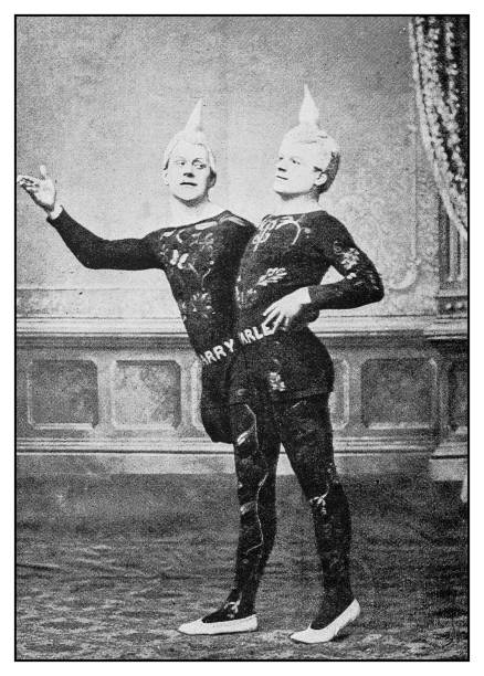 Antique photo: Donatos, One-legged Acrobatic Clowns Antique photo: Donatos, One-legged Acrobatic Clowns circus photos stock illustrations