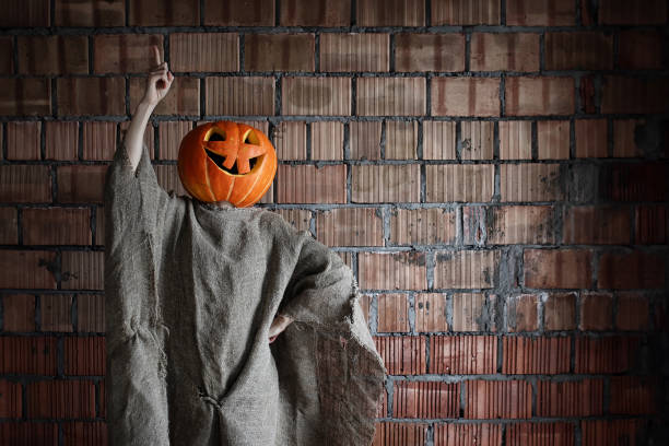istock pumpkin head monster sign hand space halloween 1149585514