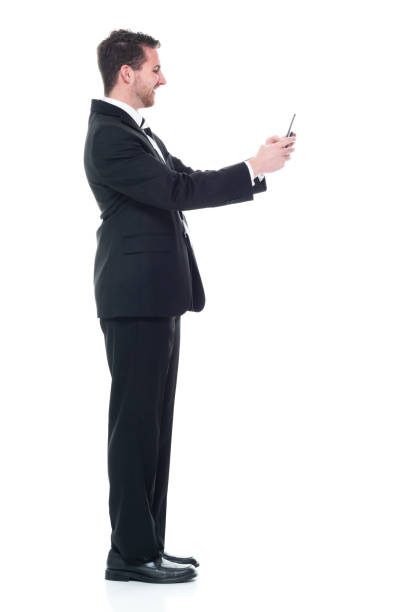 istock Young handsome businessman wearing a suit and tie - using tablet 1149585728