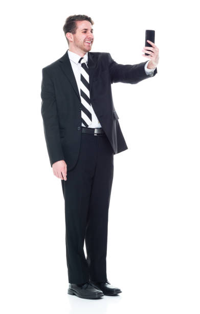 istock Young handsome businessman wearing a suit and tie - taking a selfie 1149585802