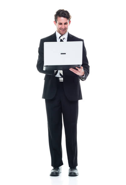 istock Young handsome businessman wearing a suit and tie - using a laptop 1149585869