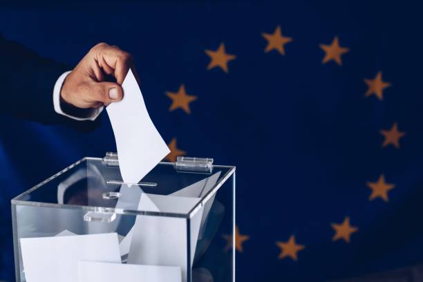 Elections to the European Parliament. EU elections. Elections to the European Parliament. EU elections. Man throwing his vote into the ballot box. european parliament stock pictures, royalty-free photos & images