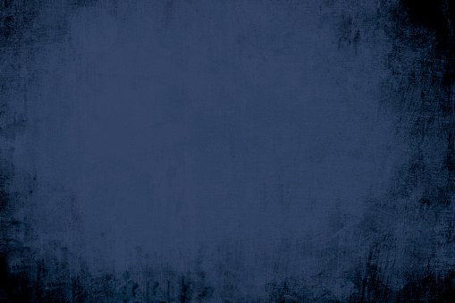 Detail of distressed wall background or texture with dark vignette borders