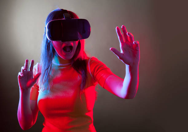 istock Young girl with VR goggles on head 1149593670