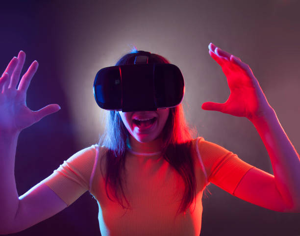 istock Young girl with VR goggles on head 1149593735