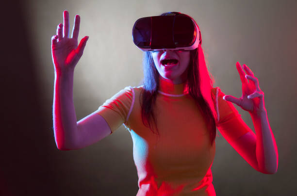 istock Young girl with VR goggles on head 1149593825