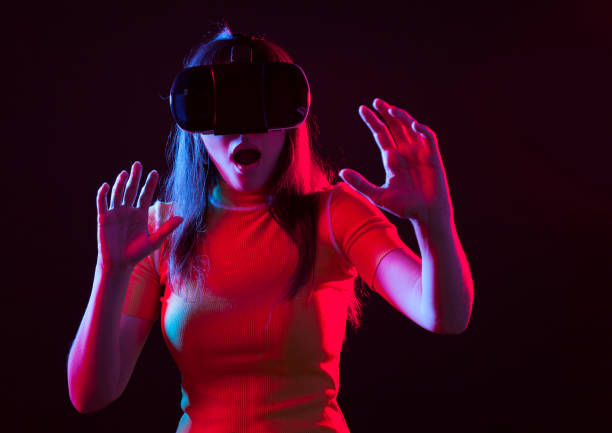 istock Young girl with VR goggles on head 1149593906