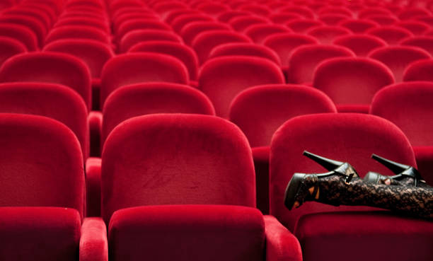 istock Legs Leaning on Theater Chair 1149595290