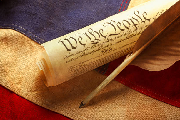 istock Feather Quill On Declaration Of Independence And American Flag 1149596404