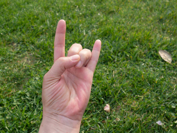istock male hand on the grass 1149597036