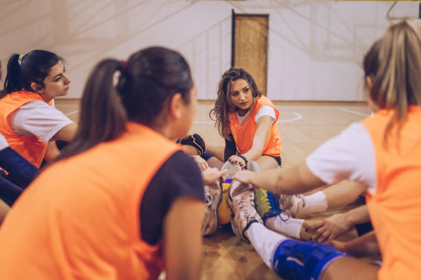 istock Volleyball players stretching before match 1149598125