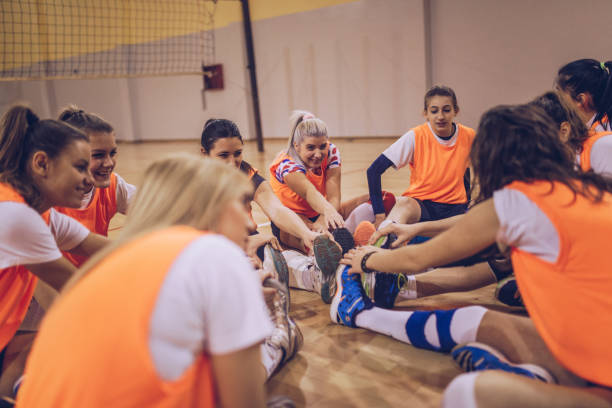 istock Volleyball players stretching before match 1149598282