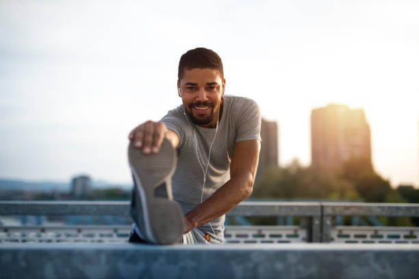 istock An attractive athlete stretching legs and preparing for running training. Active lifestyle. 1149598490