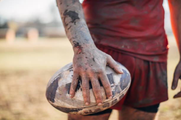istock Rugby player standing on a playing field with ball 1149599559
