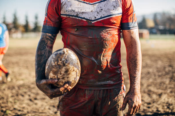 istock Rugby player standing on a playing field with ball 1149599568
