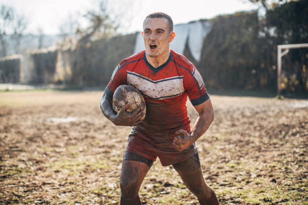 istock Rugby player standing on a playing field with ball 1149599598