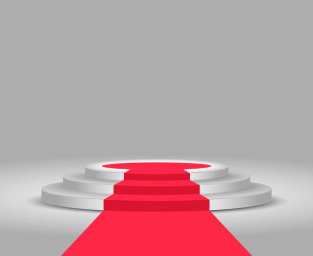 istock Stage podium. Red carpet and podium. Festive event. Stage for winners and award ceremony. Round pedestal with stairs. 1149601553