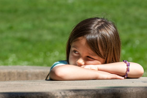 istock Sad girl child looking away 1149606337