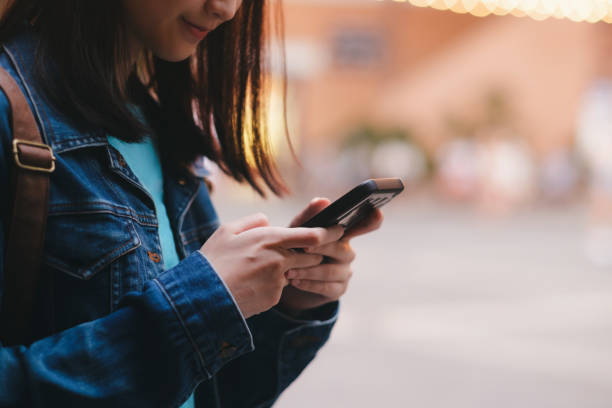 istock Teen girl using mobile phone to chat and send message. 1149608179