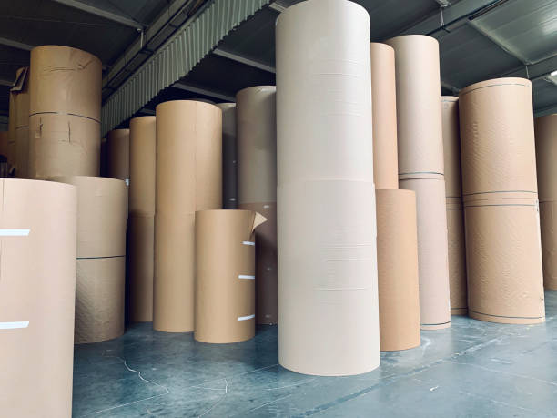 Spools of paper in the generic corrugated board plant stock photo