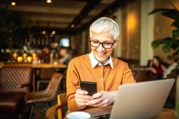 istock Smiling business woman working from the bar. 1149609792