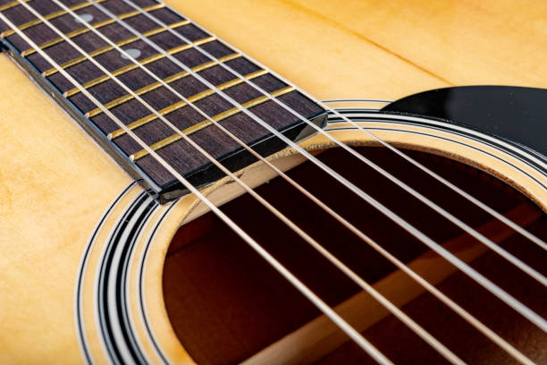 istock Classical guitar on a dark wooden table. Musical instrument stringed. Black background. 1149610328