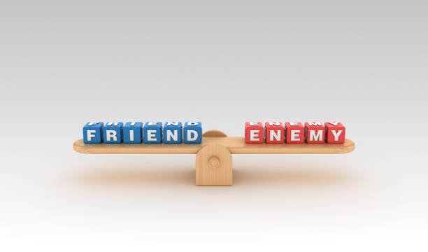 istock Seesaw with FRIEND ENEMY Buzzword Cubes - 3D Rendering 1149611820