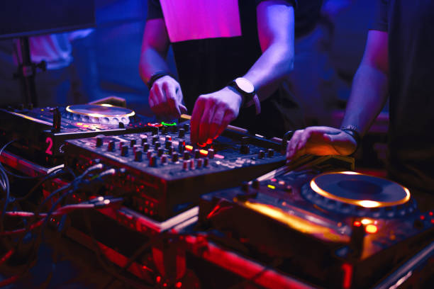 Dj's mixing music in the nightclub stock photo
