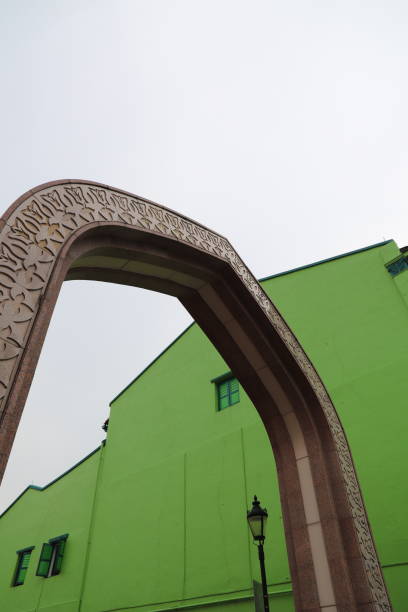 Arabic archway against a green building